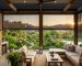Outdoor blinds enclosing a covered patio entertainment area