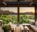 Outdoor blinds enclosing a covered patio entertainment area