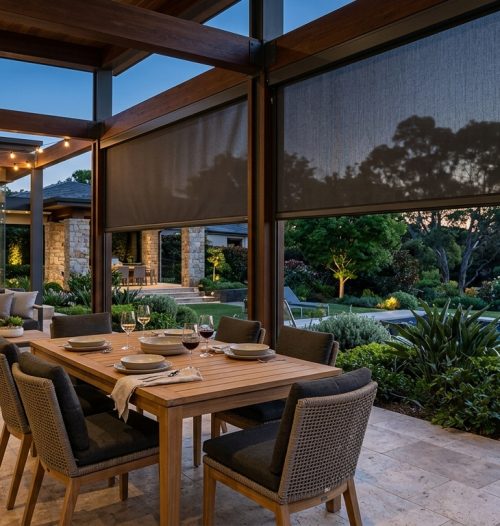 Channel-guided outdoor blinds fitted to a covered patio