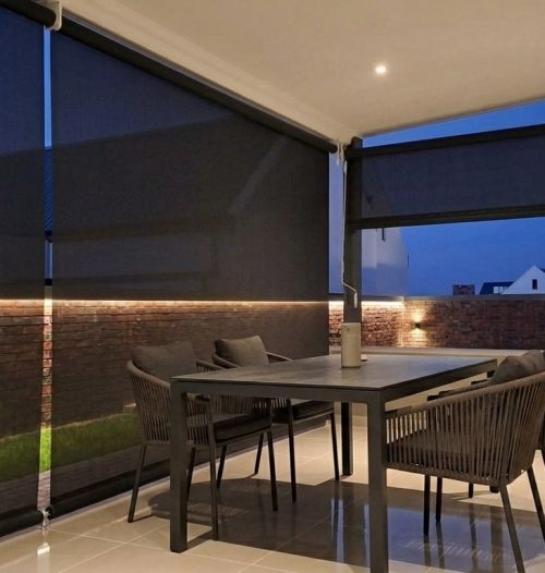 Outdoor blinds shading a furnished South African patio