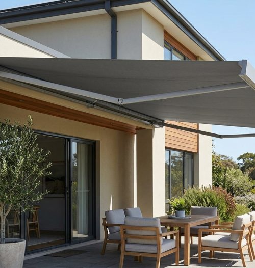 Retractable fold-arm awning shading an outdoor patio