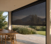 Guided outdoor blinds fitted to a covered South African patio