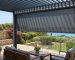 Adjustable aluminium louvre roof above a modern South African patio