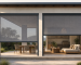 Channel-guided and zip-guided outdoor blinds compared on a modern covered patio