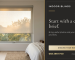 A translucent roller blind partly lowered across a bedroom window, with its frame and recess beside a bed.