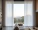 Illustrative example of sheer curtains at a living room window