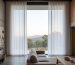Illustrative example of sheer curtains at a living room window